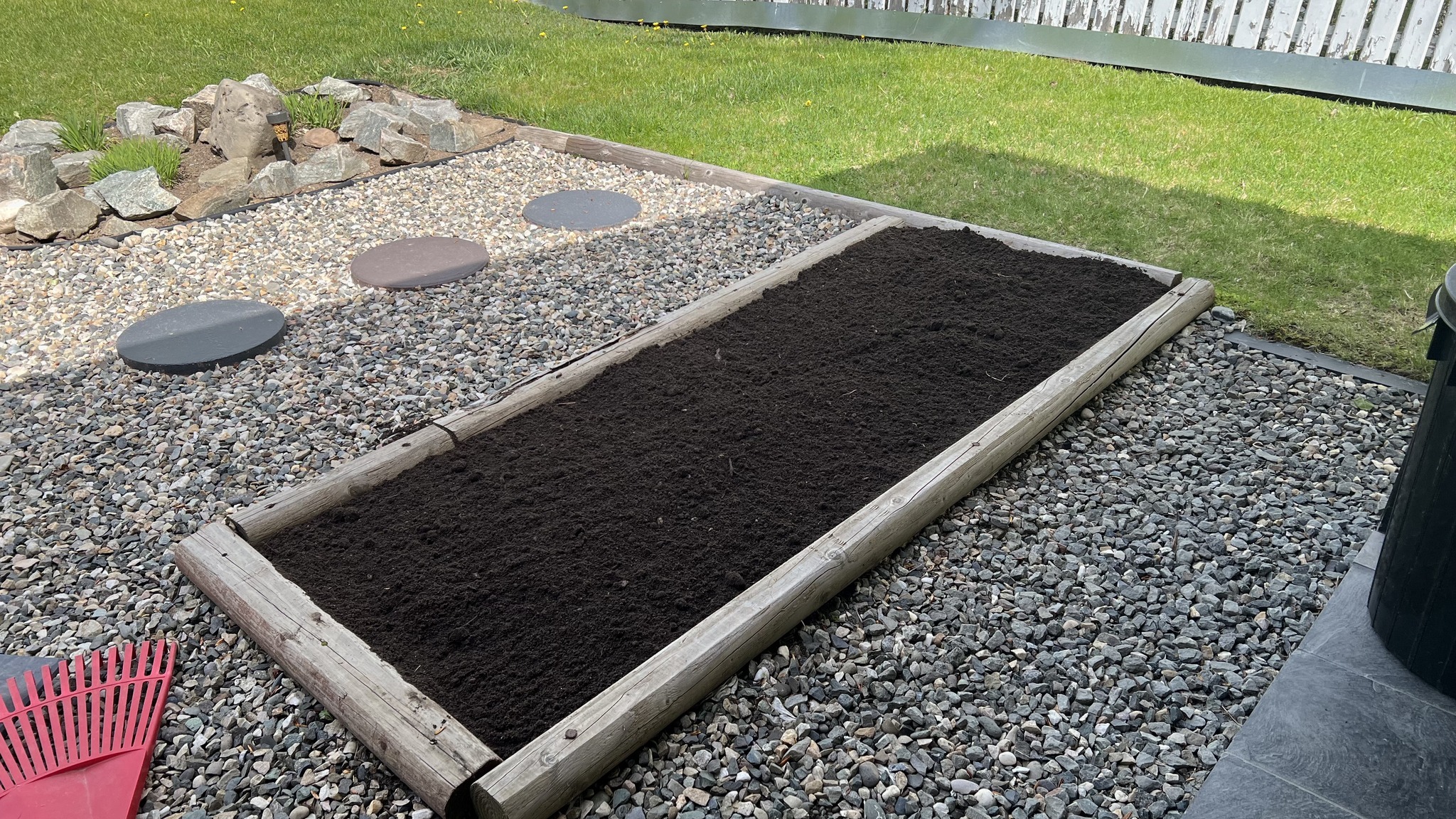 Freshly planted garden bed with mulch