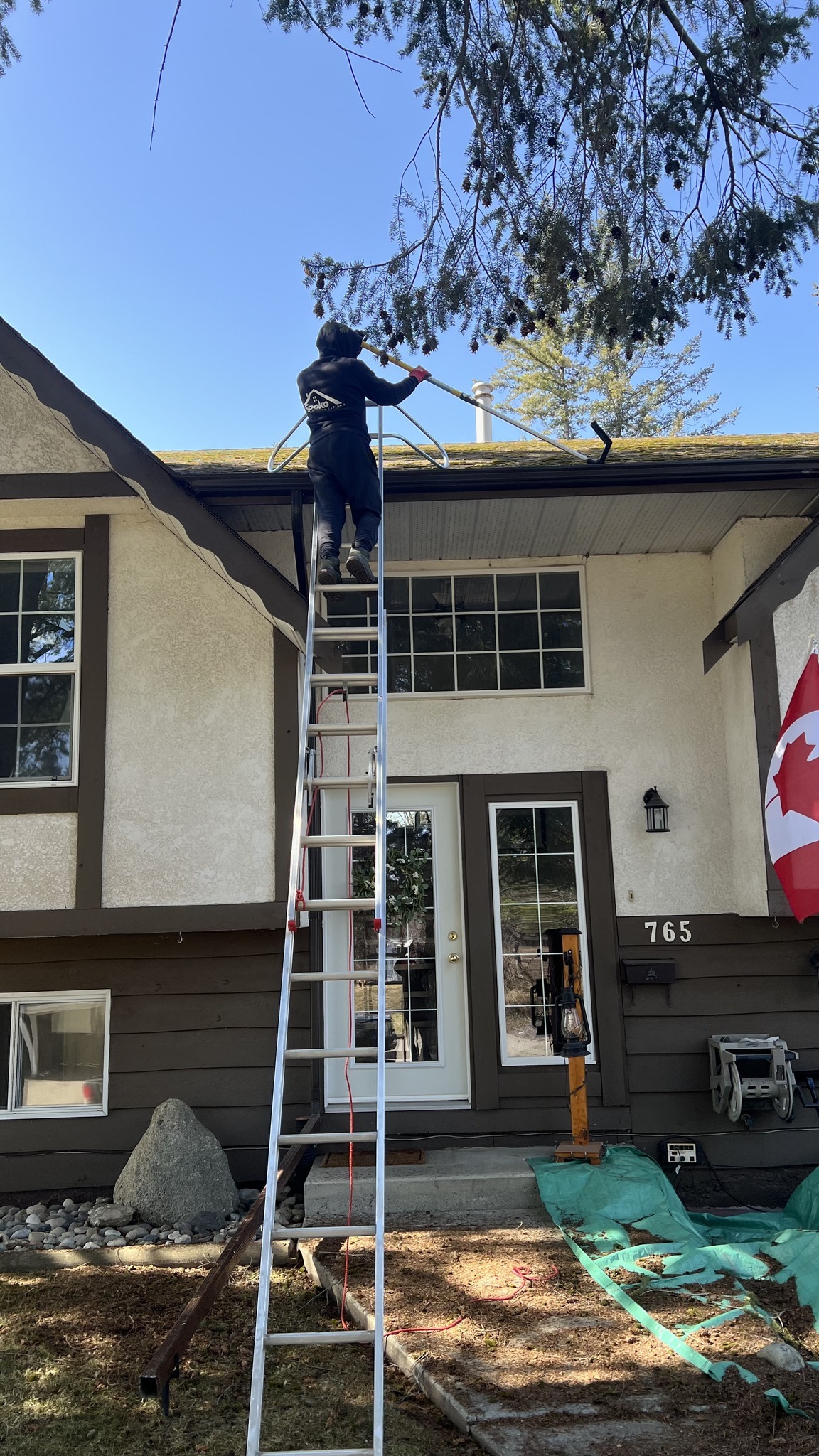 Roof cleaning in progress — team on the roof